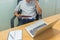 Young man reading finance document report in office