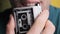 A Young Man is Recording His Speech on a Portable Retro Cassette Recorder