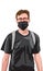 Young man with red glasses and black t-shirt wearing facial mask and backpack. Travelling during corona virus pandemic