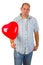 Young man with red heart ballon