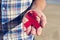 Young man with a red ribbon for the fight against AIDS, filtered