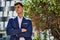 Young man relaxed wearing suit at park