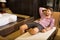 Young man relaxing in an Asian-styled hotel room