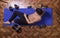 Young man relaxing smartphone elevated view exercise mat