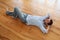 Young man relaxing on wooden floor