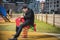 Young man reliving his childhood plying in a children\'s playground