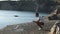 Young man with remote controller on riverbank