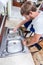 Young man repairing kitchen sink