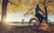 Young man ride a bicycle at the rhine shore in cologne, germany