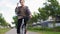 Young man riding bicycle on city street