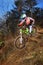 A young man riding a mountain bike