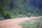 Young man riding mountain bike mtb in jungle track use for sport