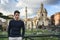 Young man in Rome standing in front of Foro Traiano and Fori Imperiali