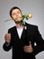 Young man with rose flower and vine bottle