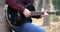 Young man`s hands playing acoustic guitar artist musician outdoors