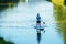 A young man is sailing in a canoe on the Nitra river