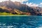 Young man sailing down the Na Pali cliffs