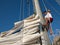 Young man on sailing ship, active lifestyle, summer sport concept