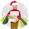 Young man in santa hat walking with shopping bags and boxes - christmas, sale, discount and holidays concept