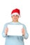 Young man in santa\'s hat holding empty blank