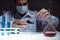 Young man scientist using auto-pipette with flask in medical science laboratory. Researcher concept.