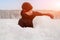 young man sculpts from snow. The concept of active recreation and leisure for teenagers.