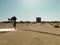 Young man searching through sand with light