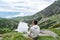 Young man seated in the High Tatras mountain looking the scenery