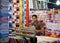 Young Man Selling Fabrics in Traditional Bazaar of Tehran