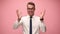 young man in shirt and tie on pink background