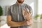 Young man showing his hand with adjustable support braces on his injured fingers