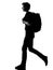 Young man silhouette backpacker walking