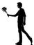 Young man silhouette offering flowers bouquet