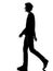 Young man silhouette smiling walking