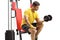 Young man sitting on a fitness machine and exercising with a dumbbell