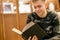 Young man sitting at home library and read a book, chill and relax f