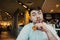 A young man sitting in a nice restaurant fast food burgers and breakfast