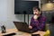 Young man sitting at the office table, working in the office on a laptop. Business, consultation, online training