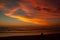 Young man sitting outdoors watching the sunset. Thinking and relaxing concept, Australia