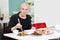 Young man sitting at sushi bar, smiling