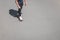 young man on skateboard on asphalt road with copy space from above