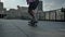 Young man skateboarder doing skateboard trick in daytime in summer, sport concept, urban concept