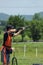 Young man skeet shooting with airborne shell