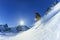 Young man skiing powder snow in mountains in winte