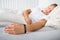 Young man sleeping wearing smart wristband