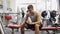 Young man with smartphone in gym