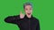 Young man smile and showing likes on green screen. Happy gay with color hair