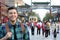 Young man smiling in a crowded Asia