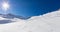 Young man snowboarder running downhill in powder snow, Alpine mo