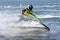 Young man speeding along on jetbike during a race